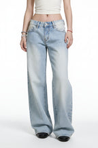 Light blue jeans worn by a person on a white background