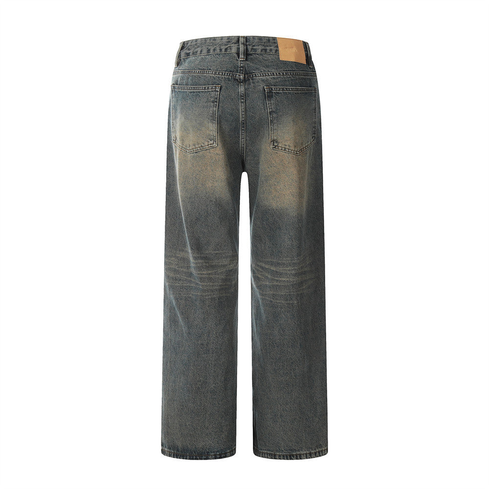 Back view of a pair of blue jeans on a white background