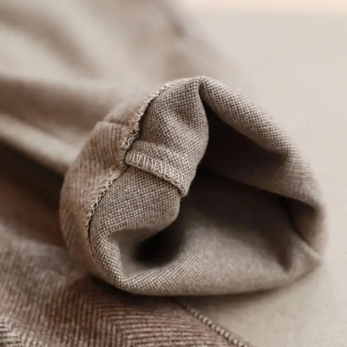 Close-up of beige fabric with a focus on texture and color.