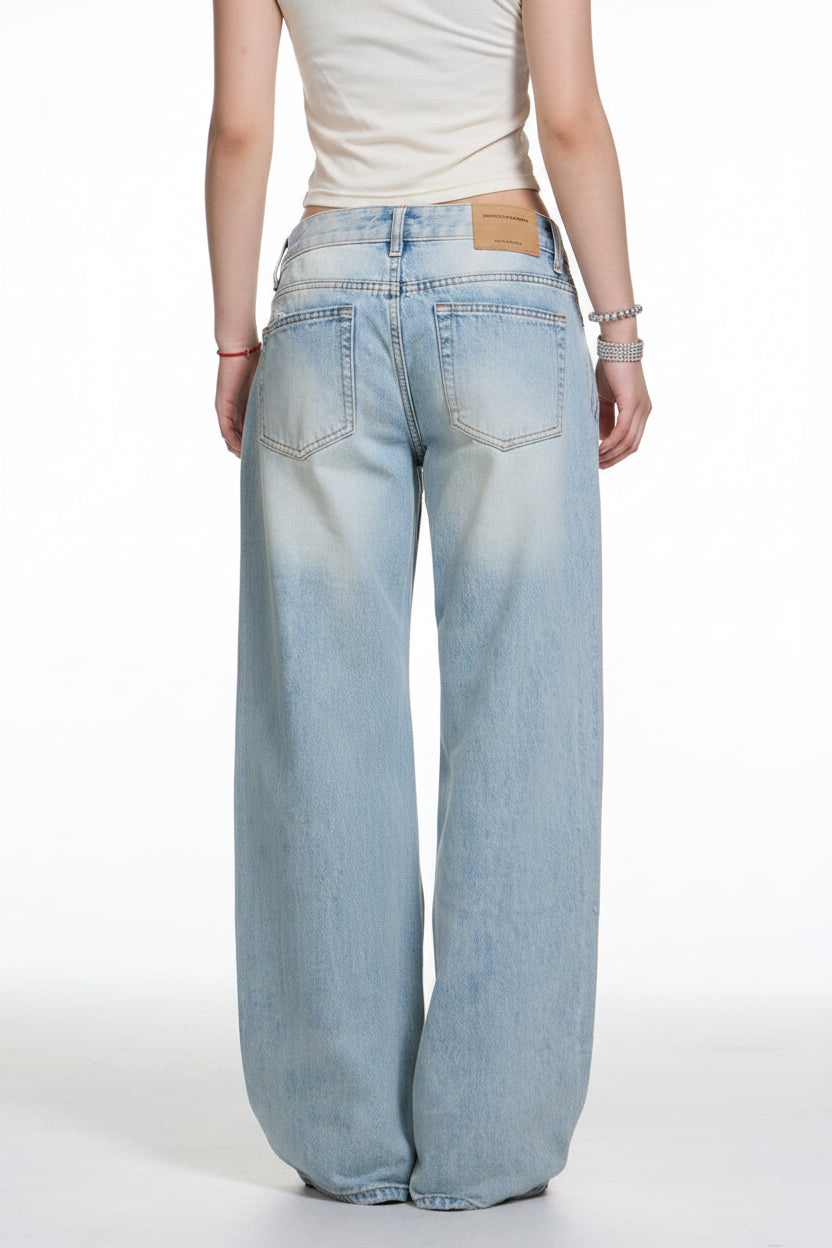 Light blue jeans worn by a person on a white background