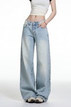 Light blue jeans worn by a person on a white background