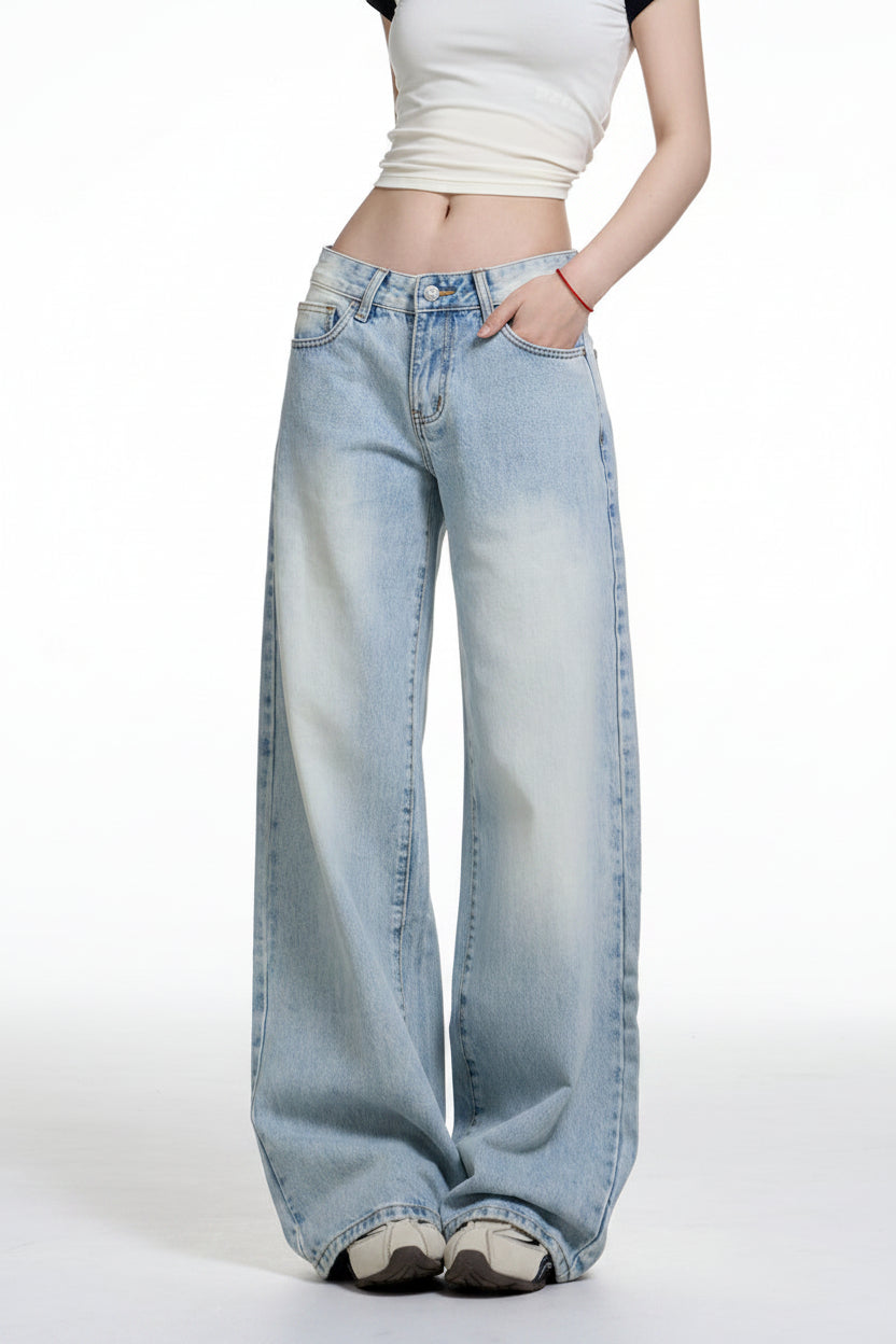 Light blue jeans worn by a person on a white background