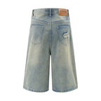 Light blue denim shorts with a brand label on a white background