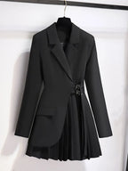 Black blazer with a pleated skirt on a white background