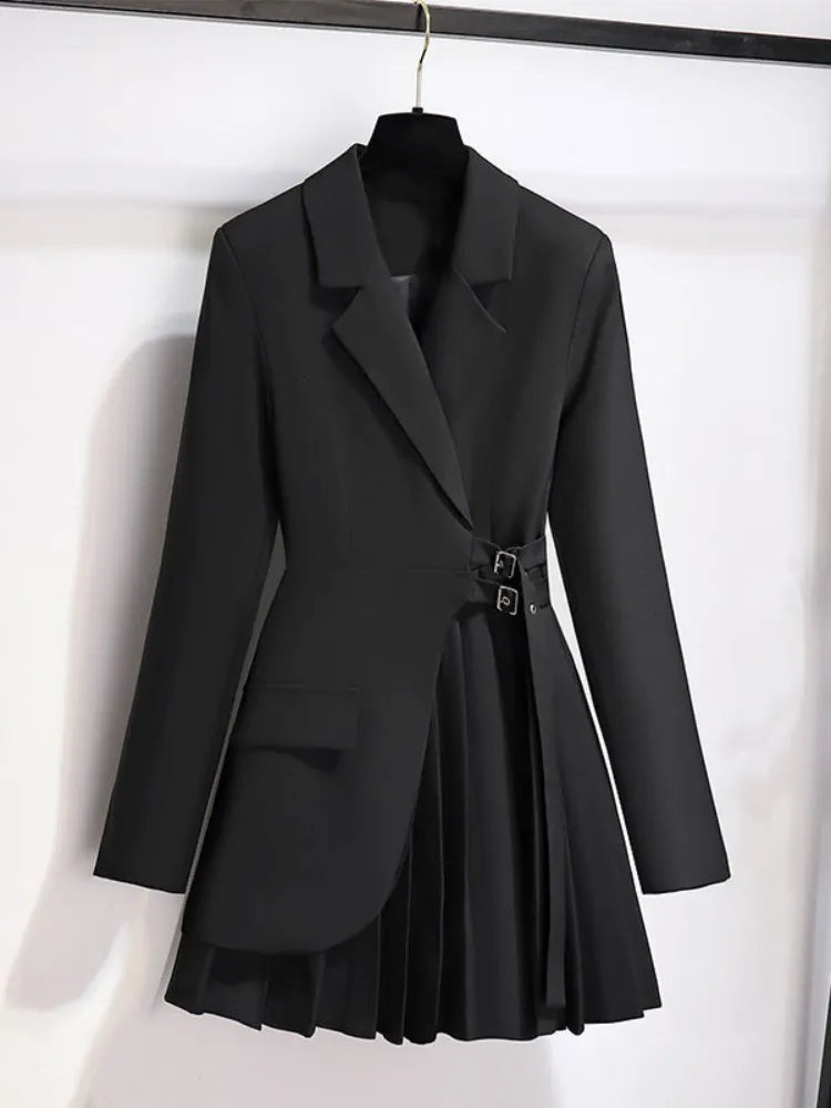 Black blazer with a pleated skirt on a white background
