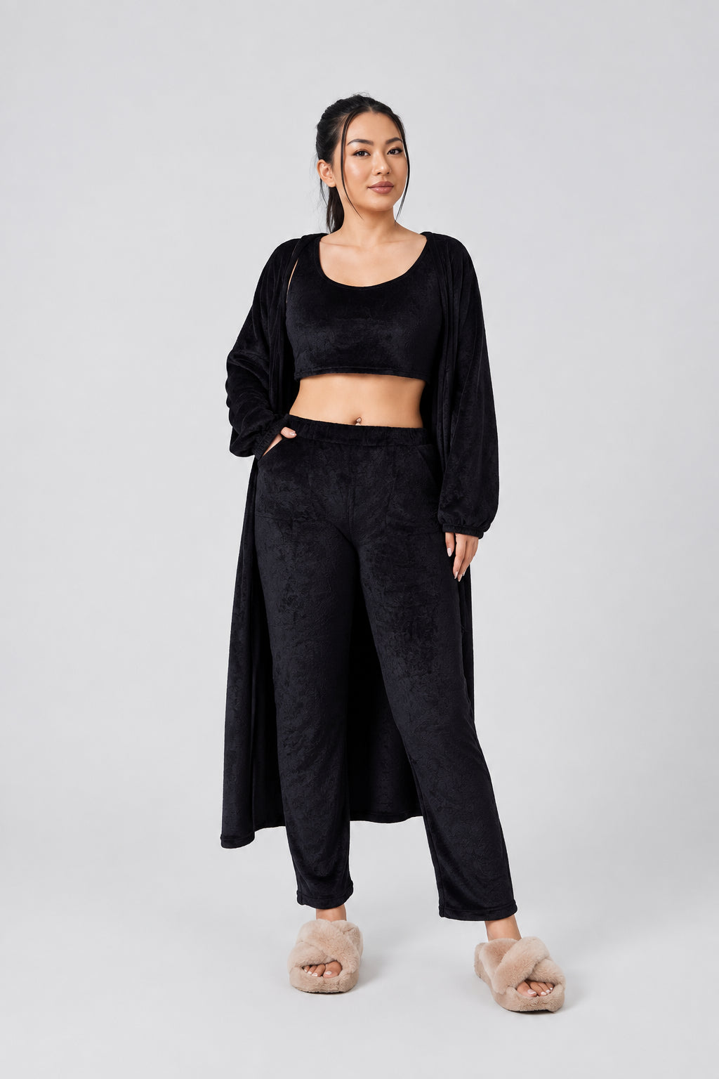 Woman wearing a black outfit on a white background