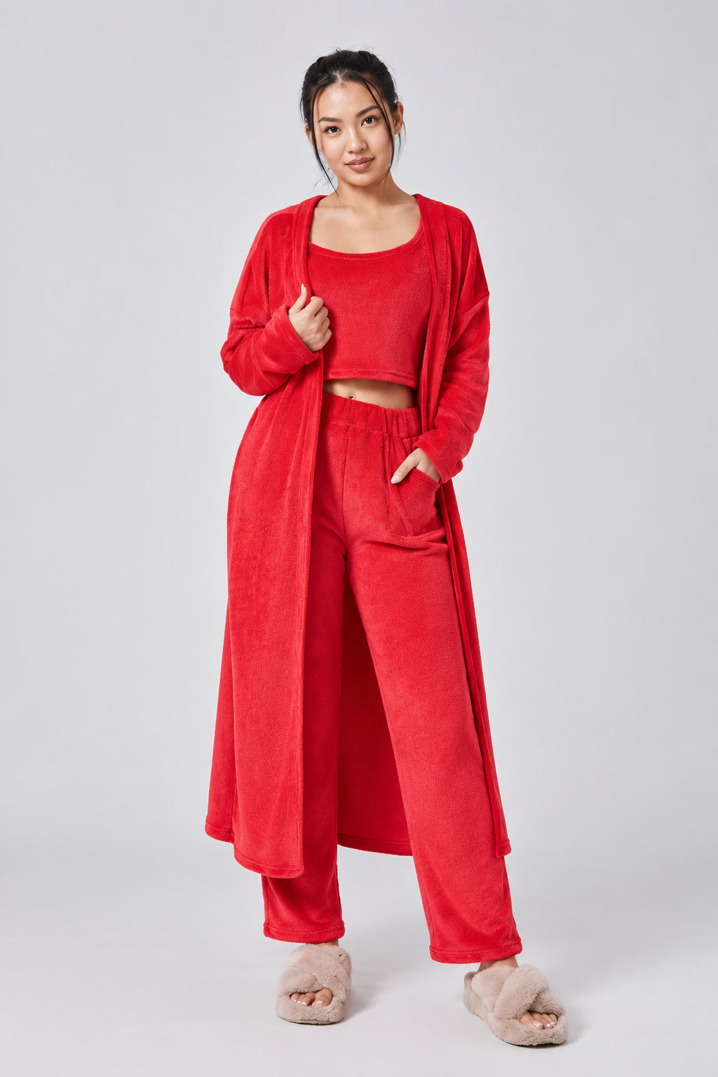 Woman wearing a red outfit on a white background