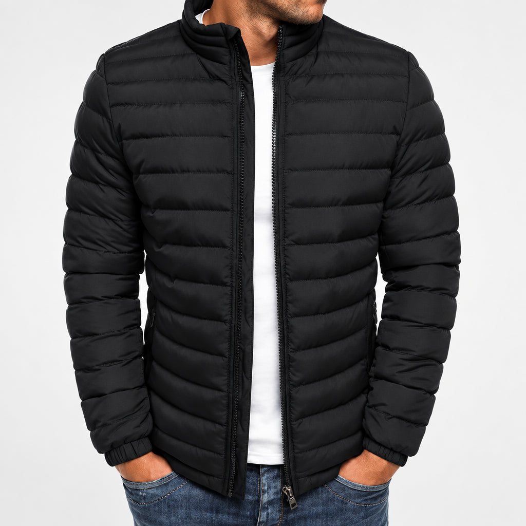 Black puffer jacket worn by a person on a white background