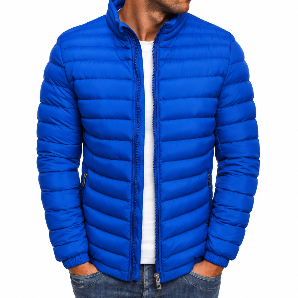 Blue puffer jacket worn by a person on a white background