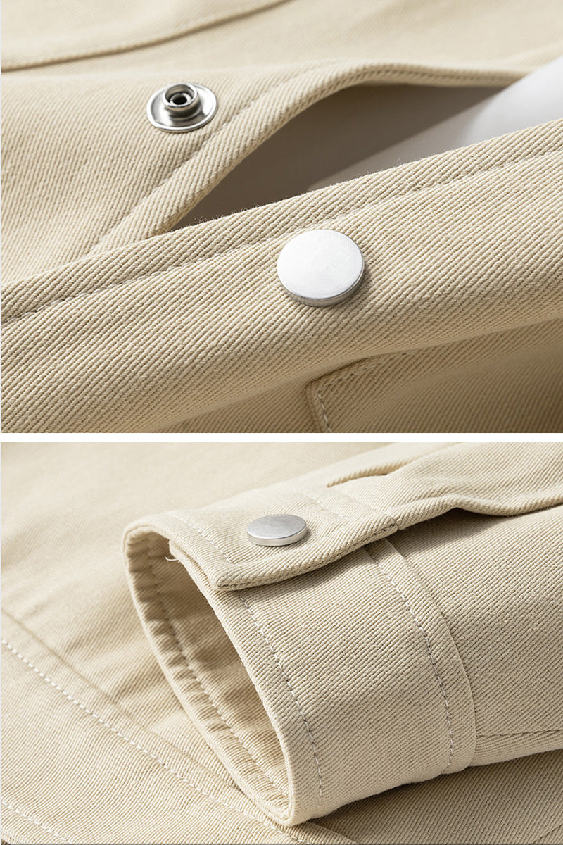 Close-up of beige fabric with buttons and stitching details