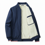 Navy blue jacket with cream sherpa lining on a white background