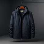 A dark navy hooded jacket hanging on a wooden hanger against a dark gray studio background.