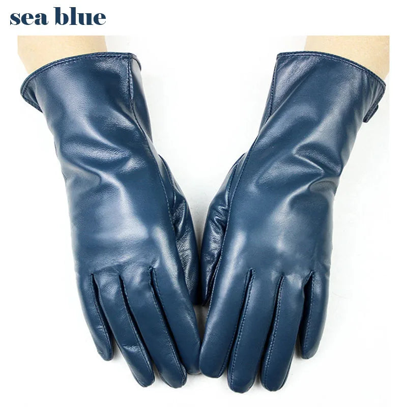 Pair of sea blue leather gloves on a white background