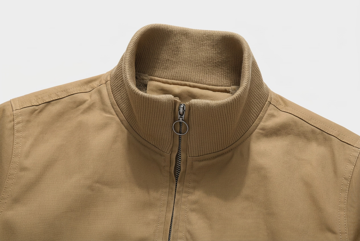 Close-up of a tan jacket showing the stand collar with a zipper, labeled '1.Stand Collar' at the bottom left.