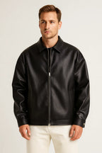Man wearing a black leather jacket on a white background