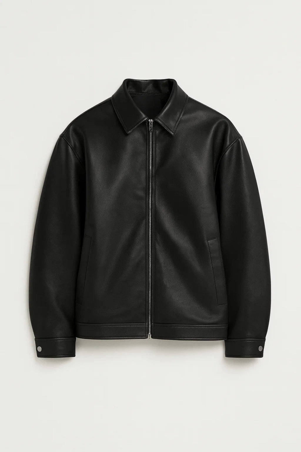 Black leather jacket on a light gray background