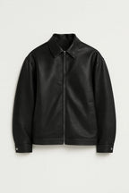 Black leather jacket on a light gray background
