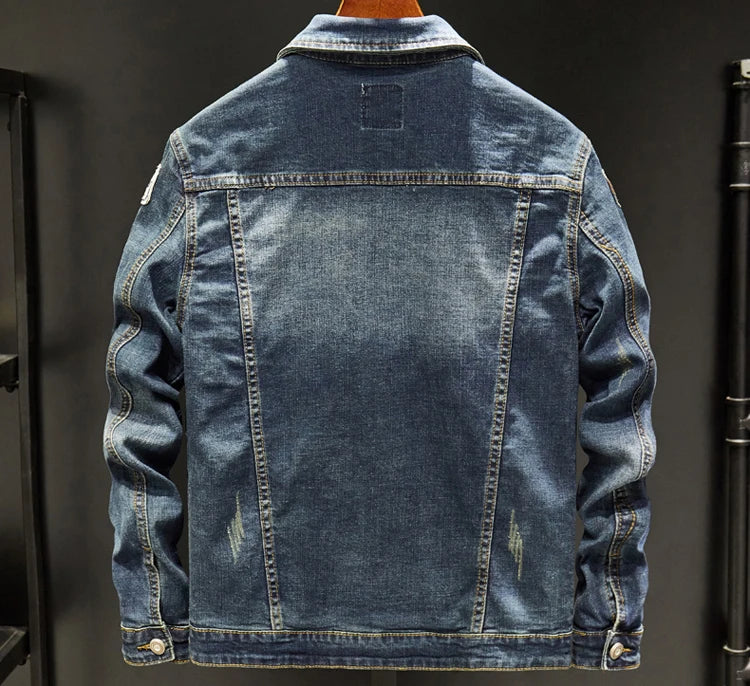 Denim jacket displayed against a dark background