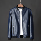 Blue leather jacket on a hanger against a dark background