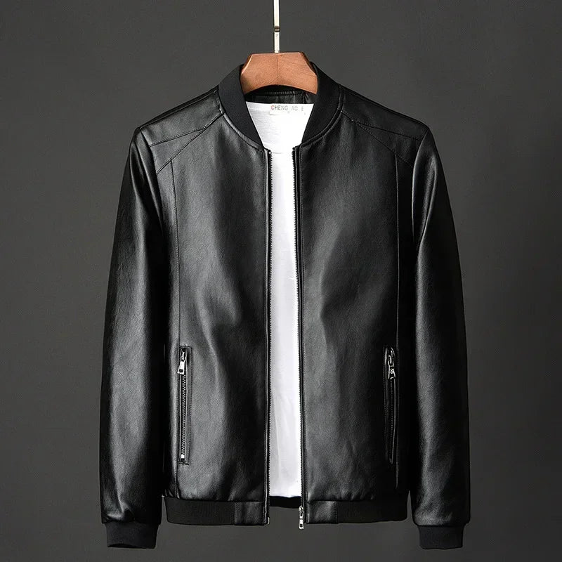 Black leather jacket on a hanger against a gray background