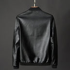 Black leather jacket on a gray background