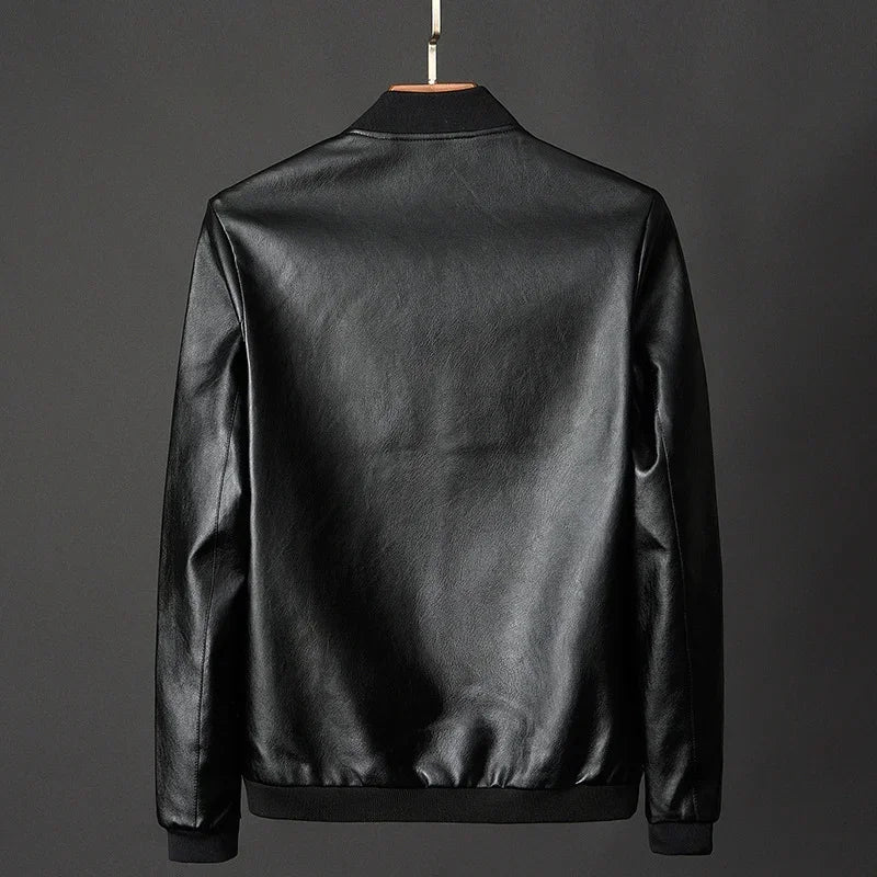 Black leather jacket on a gray background