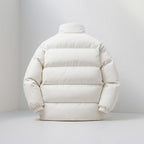 White puffer jacket on a light gray background