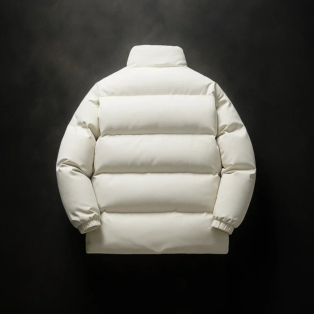 A cream-colored puffer jacket shown from the back, featuring horizontal quilting, a high collar, and elastic cuffs, set against a dark textured background.