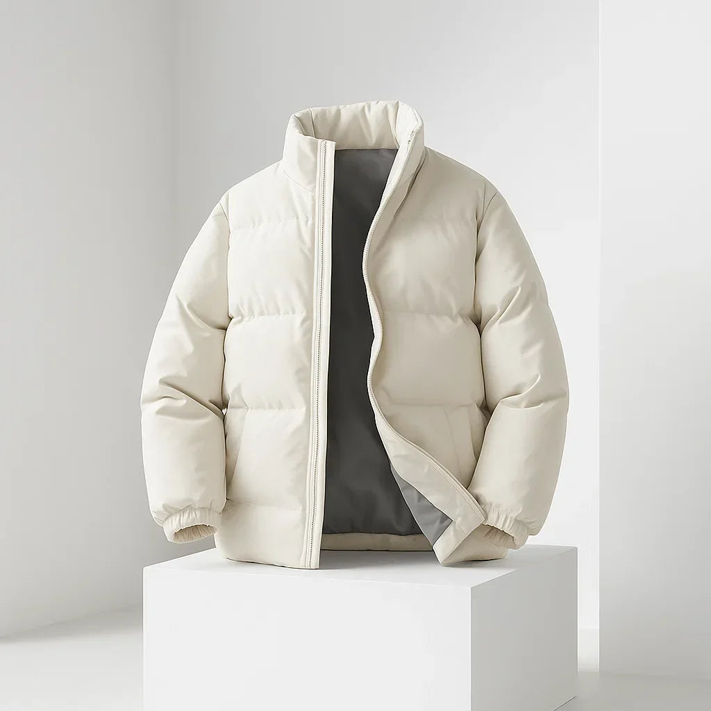 Beige puffer jacket on a white pedestal against a light gray background