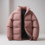 Pink puffer jacket on a light gray background