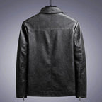Black leather jacket on a gray background