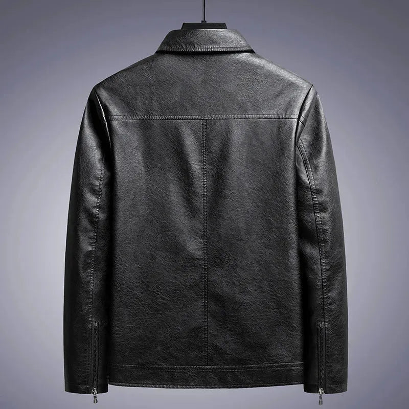 Black leather jacket on a gray background