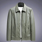 Green leather jacket on a gray background