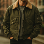 Person wearing a green jacket with a brown fur collar against a blurred background