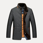 Gray quilted jacket with brown collar and plaid lining on a light gray background