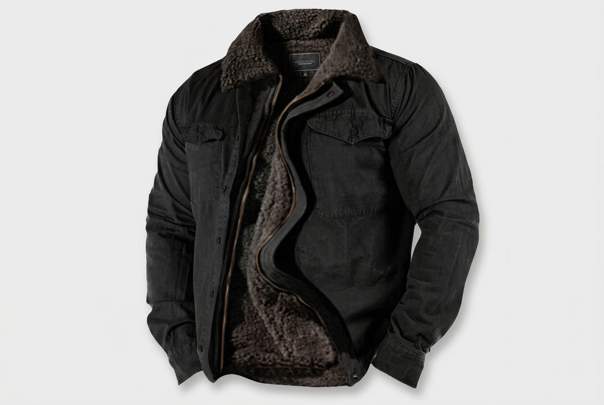 A black denim-style jacket with a dark brown sherpa fleece lining, shown open against a light gray background.