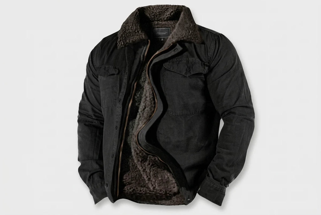 A black jacket with a dark brown sherpa lining, shown open against a light gray background.