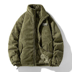 Green corduroy jacket with a brand label on a white background