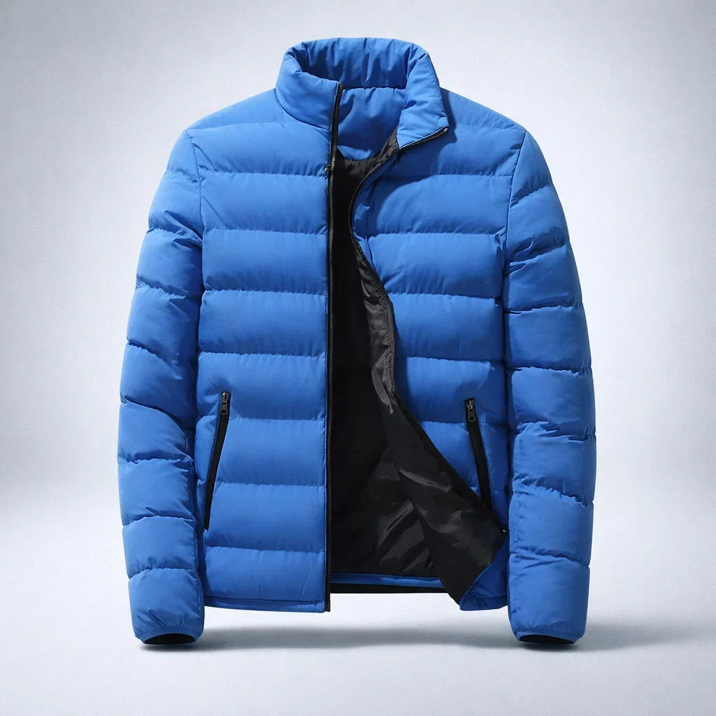 A bright blue puffer jacket with a black interior lining and black zipper details, shown open against a light gray studio background.