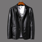 Black leather jacket on a hanger against a gray background