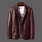 Brown leather jacket on a hanger with a gray background
