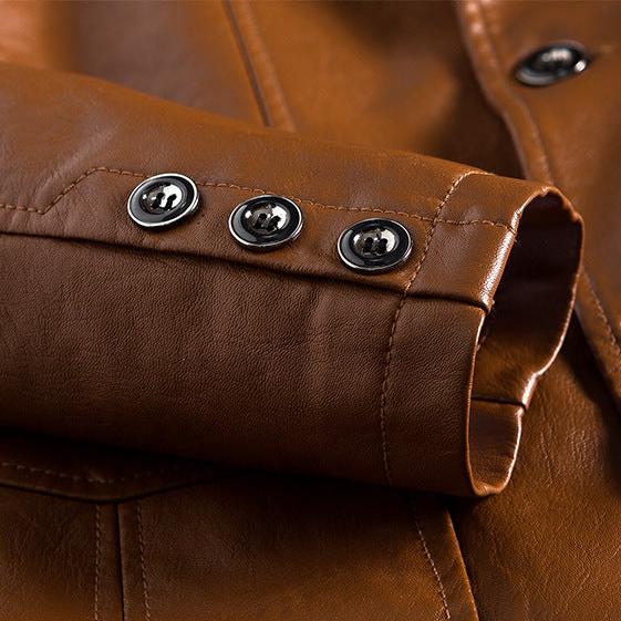 Close-up of a brown leather jacket with silver buttons