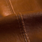 Close-up of brown leather with visible stitching