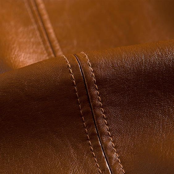 Close-up of brown leather with visible stitching