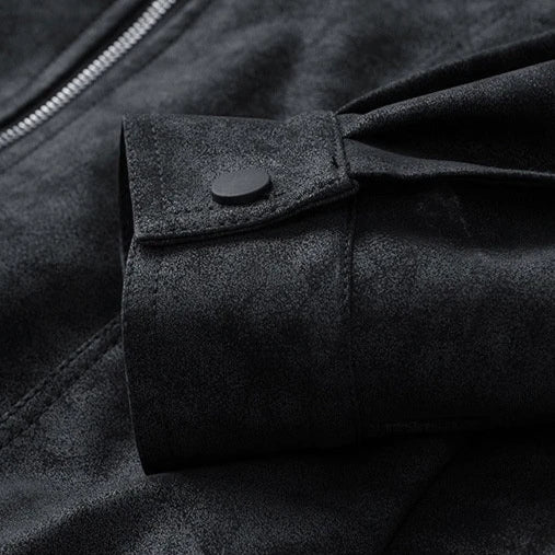 Close-up of a black jacket with a buttoned pocket