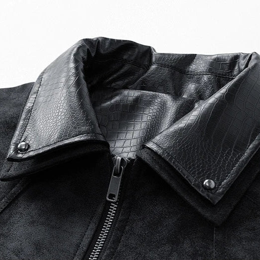 Close-up of a black leather jacket with crocodile texture collar on a white background