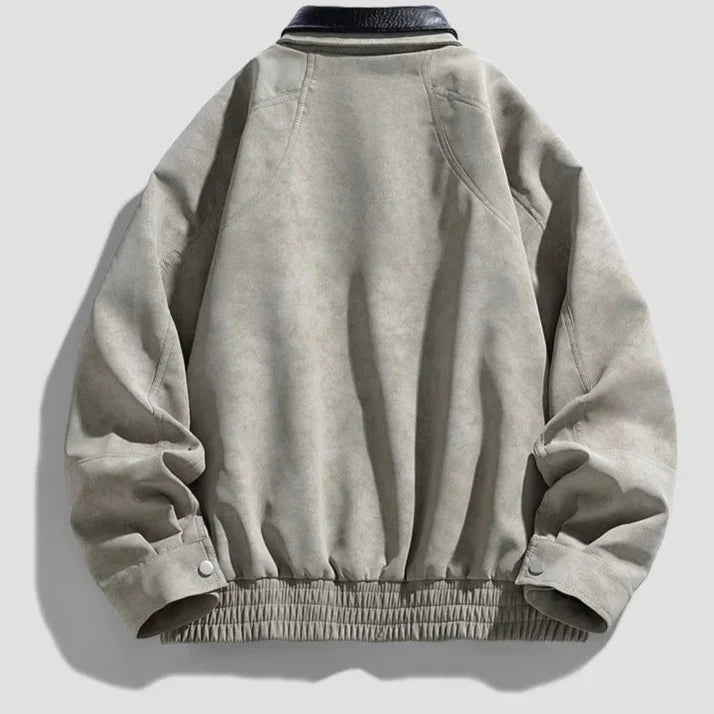 Light gray jacket with black leather collar on a light gray background
