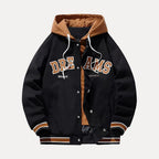Black and brown varsity jacket with 'DREAMS' text on a white background