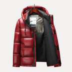 Red puffer jacket on a hanger with a white background