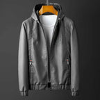 Gray jacket with a hood on a dark background